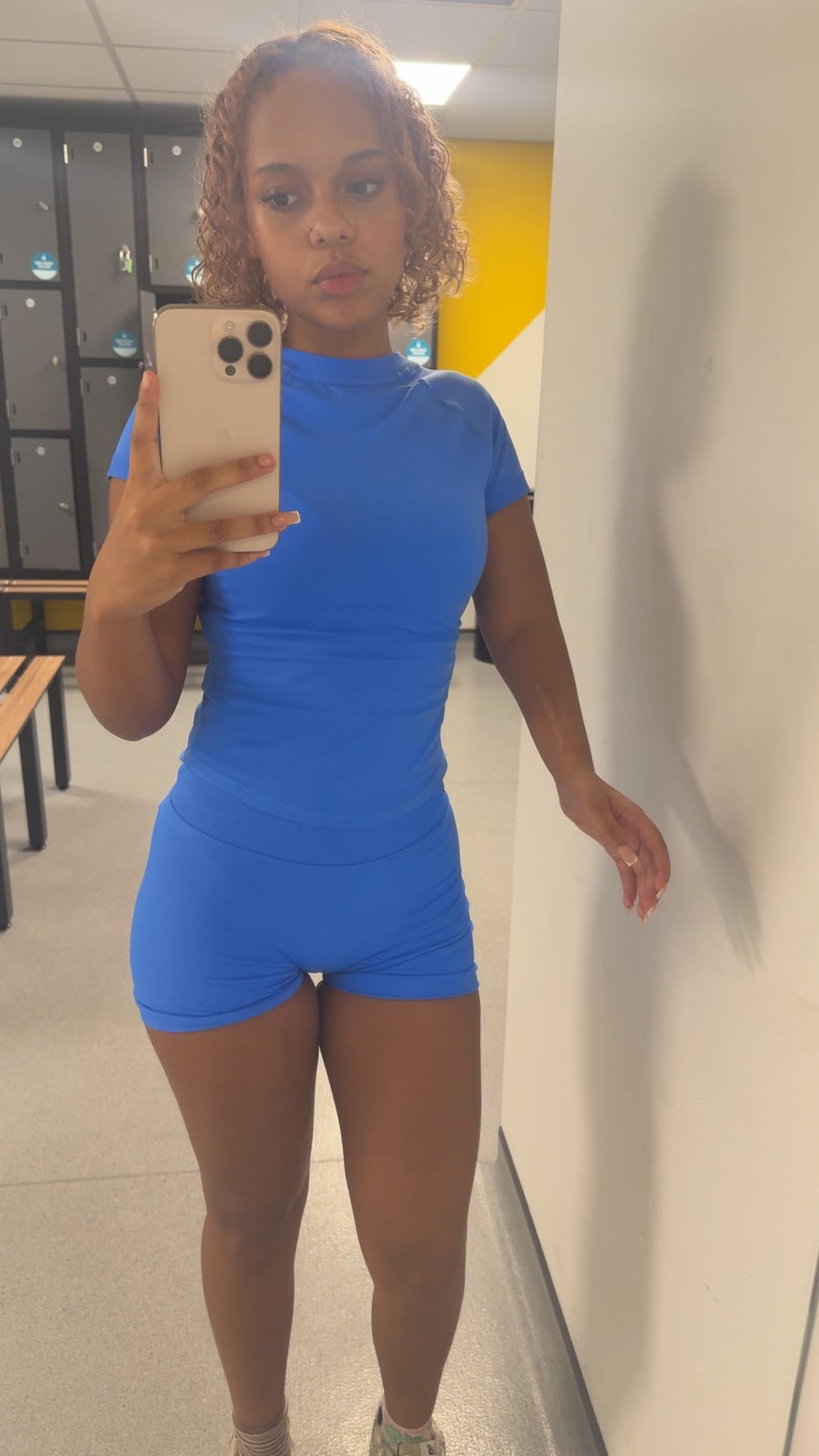 Baddie Betty wearing Dazzling Blue, 'Pearl' Ladies Gym set, Short sleeved top, with scrunch bum, shaped shorts.