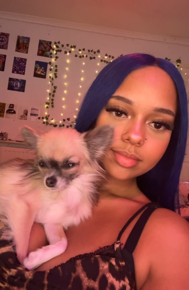 Baddie Betty cuddling her Teacup Chihuahua, Penelope.