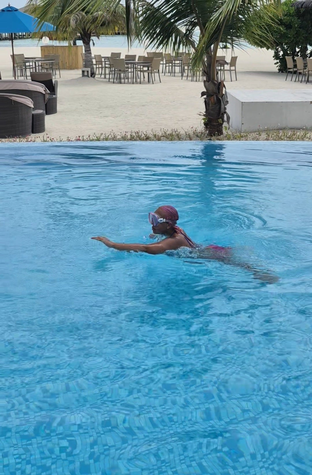 Disabled Baddie Betty swimming backstroke & freestyle at Cocoon resort in the Maldives.