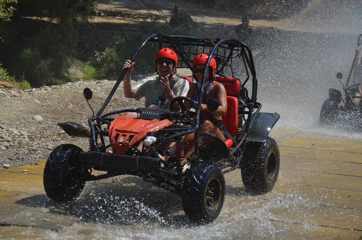 Disabled Baddie Betty driving an off road buggy with one hand.